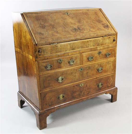 An early 18th century walnut and featherbanded bureau, W.3ft